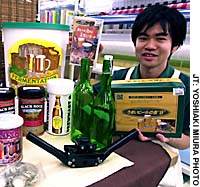 A shop assistant shows off some of the wide selection of homebrewing supplies available at the Tokyu Hands store in Shibuya, Tokyo. Some beer to call your own
