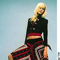 A black rayon cropped jacket from Miss Ashida  is paired with a striking geometric-printed silk-twill skirt. | COURTESY OF THE SANKEI SHIMBUN/THE JAPAN ARTS ASSOCIATION