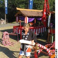 Amy examines a feature from a \"mikoshi.\" | VISION QUEST PHOTOS