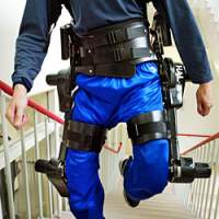 A \"robot suit\" in use at the University of Tsukuba in Ibaraki Prefecture north of Tokyo in June 2005. It was developed there to help the aged and disabled to walk, using metal legs and a computer that detects electrical signals in the muscles, then activates motors linked to the legs to support the wearer\'s movements. | AP PHOTO