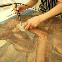 Painstaking work restores a tsunami-damaged painting to its former glory. Art disaster turns out to have a silver lining