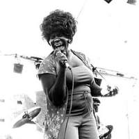 Koko Taylor belts it out at a Chicago festival and, below, with Shun Kikuta | PHOTOS COURTESY OF STEVE KAGAN/ALLIGATOR RECORDS (above)/KENJI ODA