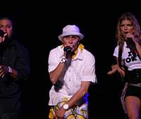 Fergie (above, far right) and her Black Eye Peas cohorts woo the masses at Summer Sonic 07, which took place simultaneously last weekend in Chiba and Osaka; Lovefoxxx (below) of Brazilian electro act Cansei de Ser Sexy grabbed the limelight clad in a striking, striped leotard. Girls have all the fun