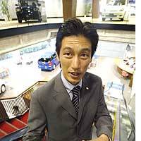 Hiroshi Ishizawa, sales manager at a Toyota dealership in Tokyo, explains the firm\'s strategy. | TOMOKO OTAKE PHOTO