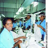 Women sew fair-trade T-shirts at a factory in India in this undated file photo. | HIROKO NAKATA PHOTO