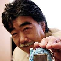Takeichi Hongo, chief Tamagotchi officer at Bandai Co., shows off a new version of the virtual pet game at the firm\'s headquarters in Taito Ward, Tokyo. | TAIGA URANAKA PHOTO