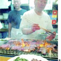 A chef grills beef at a Sendai eatery recently. | HIROKO NAKATA PHOTO