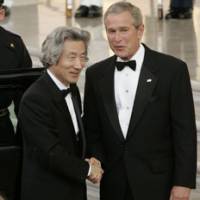 President George W. Bush welcomes Prime Minister Junichiro Koizumi to the White House for their official dinner Thursday in Washington. | AP PHOTO