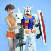 A model shows off a giant Gundam, which will hit the market Dec. 16. | PHOTO COURTESY OF BANDAI CO./KYODO