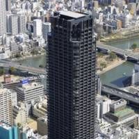 Location, location, location: Work on Japan\'s tallest condominium building was finished Tuesday in Chuo Ward, Osaka, with nearly all of the units already sold. | KYODO PHOTO