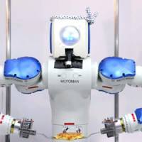 Bot time to flip it: Okonomiyaki Robot, developed by Osaka-based Toyo Riki Co., flips \"okonomiyaki\" &#8212; Osaka\'s signature pancake &#8212; Tuesday at the International Food Machinery and Technology Exhibition at Tokyo Big Sight in Koto Ward. | SATOKO KAWSAKI PHOTO