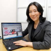 Found her calling: Cafeglobe.com President Kikuko Yano speaks at her office in Chiyoda Ward, Tokyo, on Aug. 3. | YOSHIAKI MIURA PHOTO