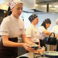 \"Udon\" stroganoff: Russian employees prepare udon dishes at a media preview Wednesday to promote the Japanese noodle chain Marugame Seimen\'s inaugural outlet in Moscow. | KYODO