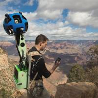 Getting the big picture: Google Maps product manager Ryan Falor uses an Android device to control the Trekker, a backpack with a camera system on top, to traverse the Grand Canyon in Arizona. Google Maps opened a virtual path to the wonders of the Grand Canyon on Jan. 31 by adding panoramic images gathered by hikers using such devices. | AFP-JIJI