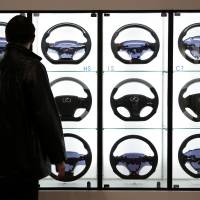 Guiding light: Steering wheels for Lexus vehicles are displayed during the Tokyo Auto Salon 2013 at the Makuhari Messe convention hall in Chiba on Jan. 11. | BLOOMBERG