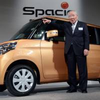The way ahead: Osamu Suzuki, Suzuki Motor Corp. chairman, introduces the new Spacia minicar Tuesday in Tokyo. | AFP-JIJI