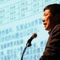 Zhang Yansheng, secretary general of the Academic Committee of the National Development and Reform Commission of China, speaks at a symposium at Keidanren Kaikan in Tokyo on July 23. Changes afoot as Beijing seeks new economic models to sustain growth