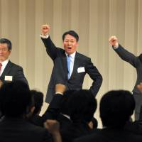 In the line of fire: Democratic Party of Japan President Banri Kaieda, who is being sued for allegedly misleading investors, expresses his resolve to lead the party Dec. 25 after being elected DPJ chief. | YOSHIAKI MIURA