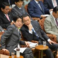 Comfort drink: Prime Minister Shinzo Abe\'s thermos bottle is within reach Tuesday during a House of Councilors Budget Committee session. | AFP-JIJI