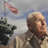 Semper fi: Norman Hatch poses for a photo near the U.S. Marine Corps War Memorial on Feb. 20 in Arlington, Virginia. | THE WASHINGTON POST