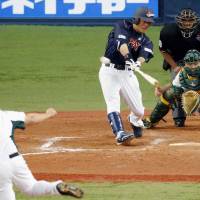 Big boost: Former major leaguer Kazuo Matsui strokes a two-out, bases-loaded triple in the fourth inning in Japan\'s 10-3 win over Australia on Sunday in Osaka. | KYODO