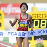 First past the post: Yuki Kawauchi crosses the finish line to win the Beppu-Oita Marathon on Sunday. | KYODO