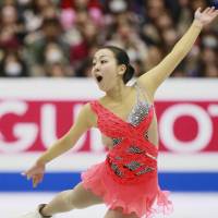 In control: Mao Asada leads the women\'s field after scoring 74.49 points in the short program at the Four Continents Figure Skating Championships on Saturday in Osaka. | KYODO