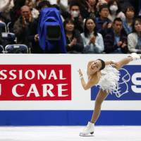 Flying colors: Mao Asada performs her free-skate routine at the Four Continents Figure Skating Championships in Osaka on Sunday. Mao won the event with a combined total of 205.45 points. | AP