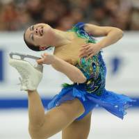 Perpetual motion: Akiko Suzuki performs her free-skate routine in Osaka on Sunday. | AFP-JIJI
