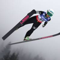 Preparation time: Ski jumper Sara Takanashi soars through the air during practice on Wednesday at the FIS World Nordic Ski Championships in Val di Fiemme, Italy. | AFP-JIJI