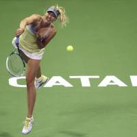 Safe passage: Maria Sharapova plays a return during her 6-3, 6-2 win over Caroline Garcia at the Qatar Open on Tuesday. | AFP-JIJI