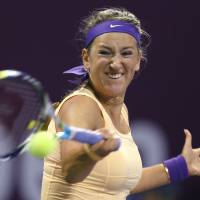 Full force: Victoria Azarenka of Belarus plays a shot during her 6-2, 6-3 second-round victory over Switzerland\'s Romina Oprandi at the Qatar Total Open on Wednesday. | AFP-JIJI