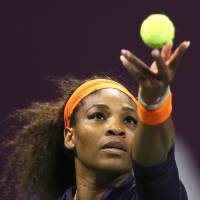 Not enough: Serena Williams, serving against Belarus star Victoria Azarenka, falls in three sets in the Qatar Total Open on Sunday. | AFP-JIJI