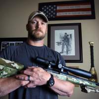 Lone gunman: Former U.S. Navy SEAL and \"American Sniper\" author Chris Kyle poses in Midlothian, Texas, last April. | AP