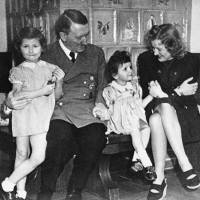 Family time: An undated photo of German Chancellor Adolf Hitler, his mistress Eva Braun and two girls were among the many items found in 1945 in a treasure chest belonging to Braun that give an intimate glimpse of the Nazi leader\'s private life. | AP
