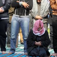 Protest central: Sunni Muslim men attend prayers at Baghdad\'s Abu Hanifa mosque Friday. | AFP-JIJI
