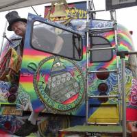 Hemp heaven: Zane Kesey emerges from the famous Merry Prankster bus that belonged to his late father, Ken Kesey, in August in Seattle. Kesey was attending the 21st annual Hempfest, a gathering on the Seattle waterfront billed as the \"World\'s Largest Profestival\" to educate about marijuana and hemp products. | AP