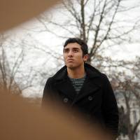 Picture of power: Activist artist Ramiro Gomez stands with his work outside the White House in Washington last Tuesday. | THE WASHINGTON POST