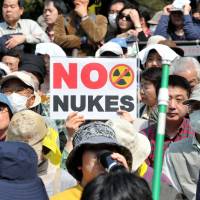 Long goodbye: Antinuclear protesters rally outside the Diet building Sunday in Tokyo, on the eve of the second anniversary of the March 11, 2011, quake and tsunami that triggered one of the worst nuclear catastrophes the world has seen.
 | YOSHIAKI MIURA