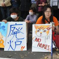 Long goodbye: Antinuclear protesters rally outside the Diet building Sunday in Tokyo, on the eve of the second anniversary of the March 11, 2011, quake and tsunami that triggered one of the worst nuclear catastrophes the world has seen.
 | YOSHIAKI MIURA