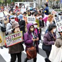 Long goodbye: Antinuclear protesters rally outside the Diet building Sunday in Tokyo, on the eve of the second anniversary of the March 11, 2011, quake and tsunami that triggered one of the worst nuclear catastrophes the world has seen.
 | YOSHIAKI MIURA