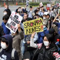 Long goodbye: Antinuclear protesters rally outside the Diet building Sunday in Tokyo, on the eve of the second anniversary of the March 11, 2011, quake and tsunami that triggered one of the worst nuclear catastrophes the world has seen.
 | YOSHIAKI MIURA