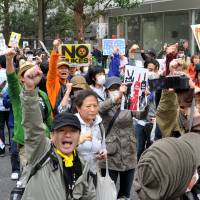 Long goodbye: Antinuclear protesters rally outside the Diet building Sunday in Tokyo, on the eve of the second anniversary of the March 11, 2011, quake and tsunami that triggered one of the worst nuclear catastrophes the world has seen.
 | YOSHIAKI MIURA