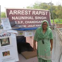 Street justice: Mahinder Kaur protests for her daughter, whom the mother says was raped in 2010 by a policeman in Punjab state, on Friday. | THE WASHINGTON POST