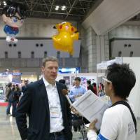 Foreign perspective: German anime buyer Daniel Otto is interviewed by members of the Japanese media on March 21 during the Tokyo International Anime Fair 2013. | KAZUAKI NAGATA .