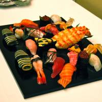 Vegas inspired: Jeff Ramsey\'s decorative creations, including black-and-gold sheets of shiitake mushroom puree and egg, and black sushi rice colored with powdered charcoal. | MELINDA JOE