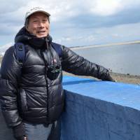 Helping hand: Ecologist Takao Suzuki studies how tidal flats recover from natural disasters. At the Sendai coast, he shows off a net that allows baby crabs to climb over one of the regions biggest environmental threats: a concrete seawall. Tohoku coast faces man-made perils in wake of tsunami