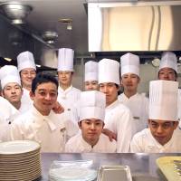 All part of the service: Thierry Voisin (far left), Chef de Cuisine at The Imperial Hotel\'s Les Saisons restaurant, with his kitchen crew. | KIT NAGAMURA