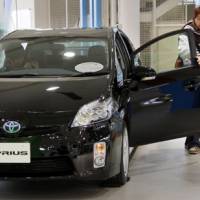 Brand new: Visitors inspect a 2010 Toyota Prius at a Toyota Motor Corp. showroom in Tokyo Thursday. | AP PHOTO