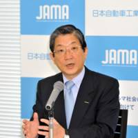 In the driver\'s seat: Toshiyuki Shiga, new chairman of the Japan Automobile Manufacturers Association, is interviewed Friday at Nissan Motor Co.\'s headquarters in Yokohama. | YOSHIAKI MIURA PHOTO